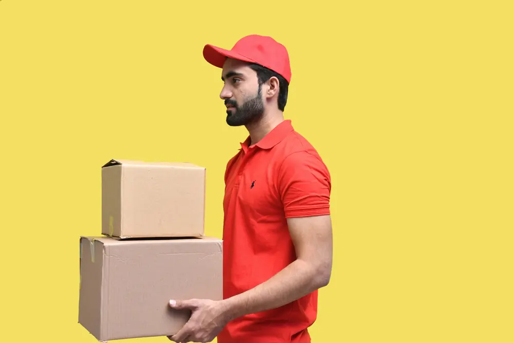 Delivery courier holding a parcel box
